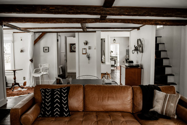 living room caramel leather sofa mudcloth warner's camp adirondack cabin rental lake placid